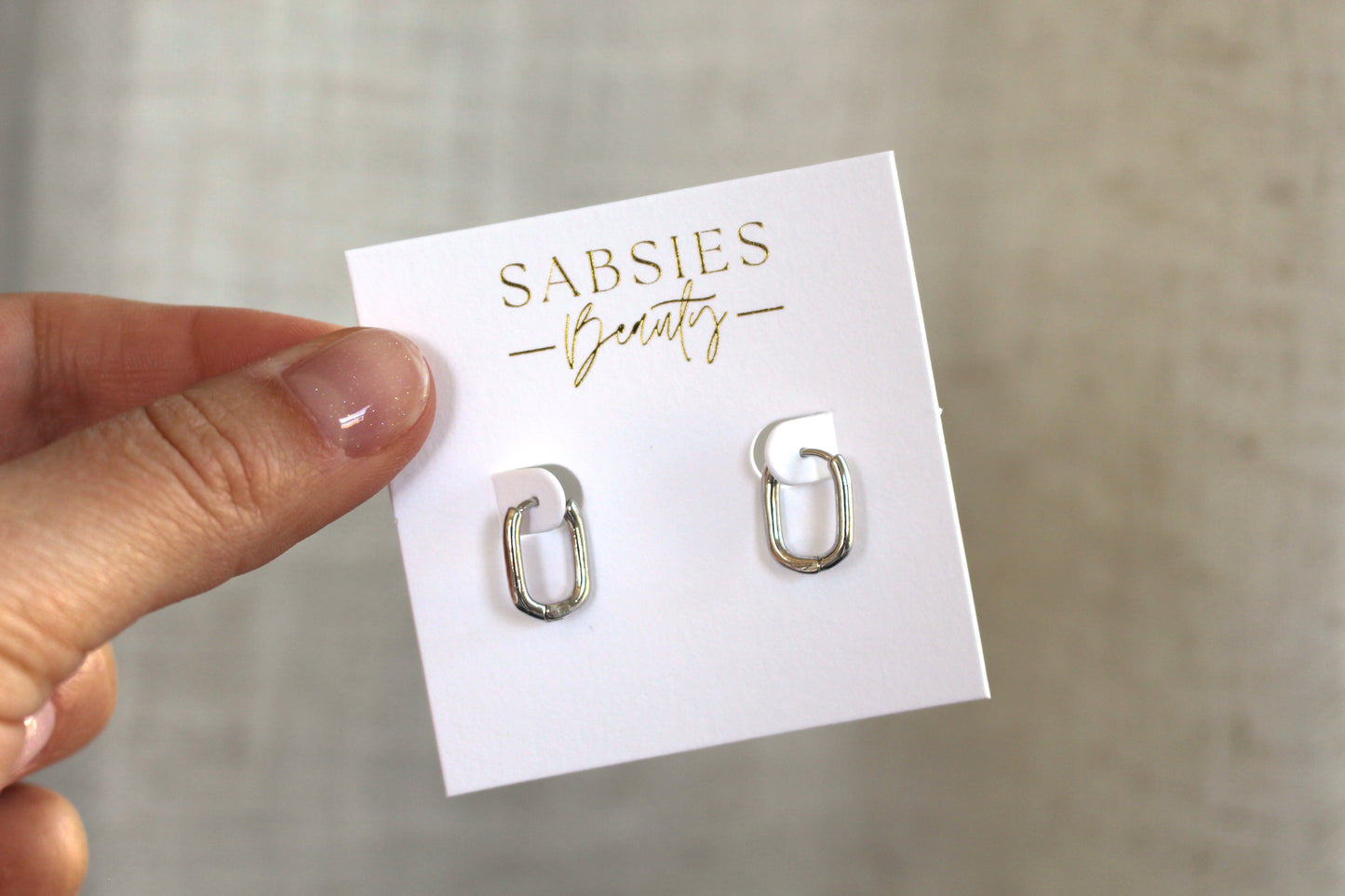 Shiny Silver Oval Rhodium Plated Huggie