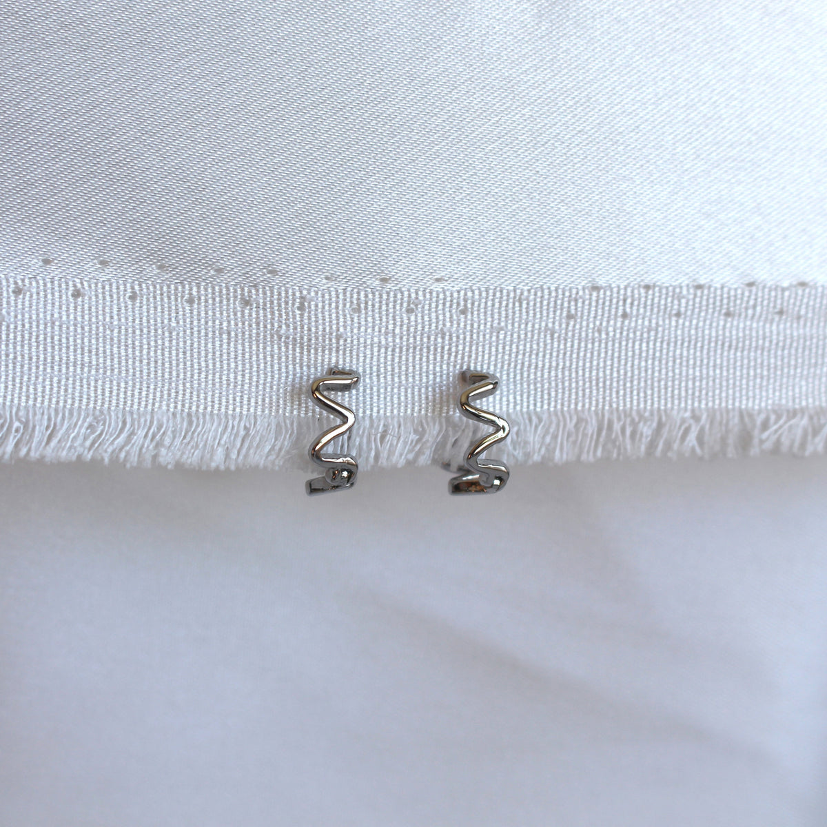 Wavy Huggie Rhodium Plated
